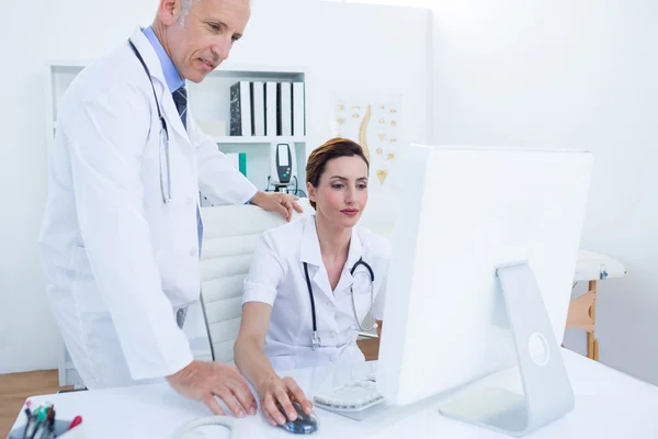Concentrated medical colleagues working with computer — Stock Photo, Image