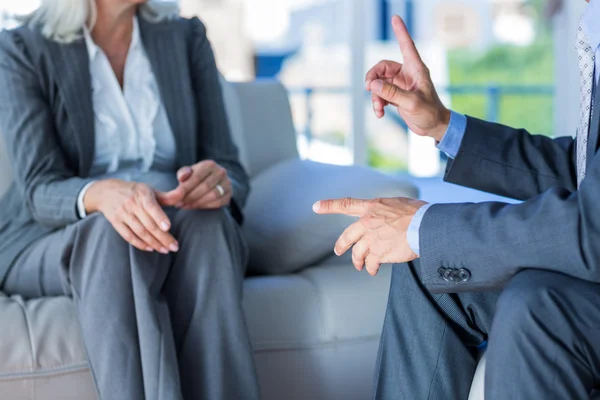 Business people speaking together on couch — Stock Photo, Image