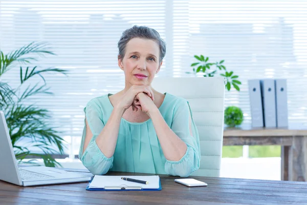 Attentive businesswoman looking at the camera — Stock Photo, Image