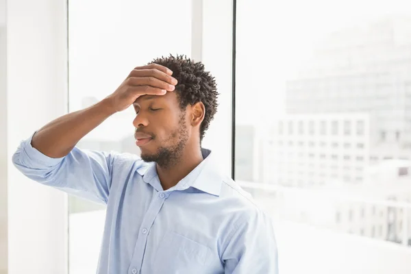 Young concentrating businessman leaning — Stock Photo, Image