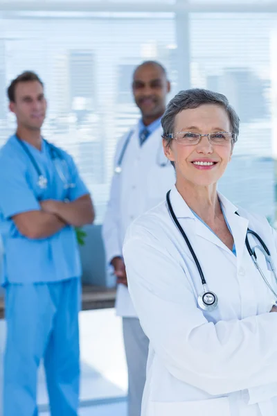 Smiling colleagues doctors looking at the camera — Stock Photo, Image