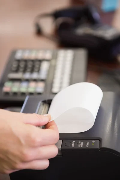 Hand of woman taking receipt — Stock Photo, Image