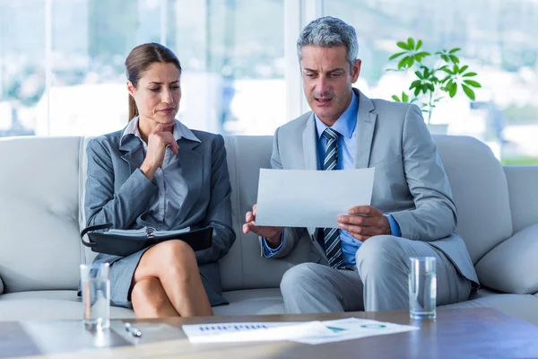 Business people looking at documents — Stock Photo, Image