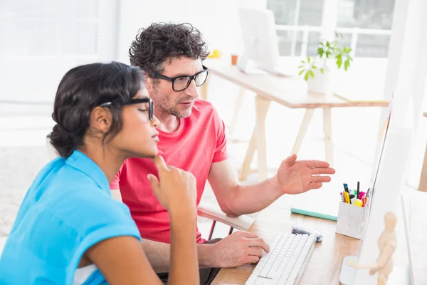 Casual business team working together with computer — Stock Photo, Image