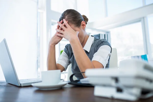 Depressed businesswoman with hands on head — Stock Photo, Image