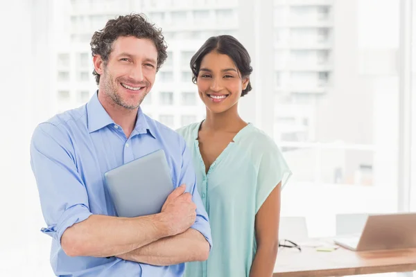 Casual business partners looking at tablet — Stock Photo, Image