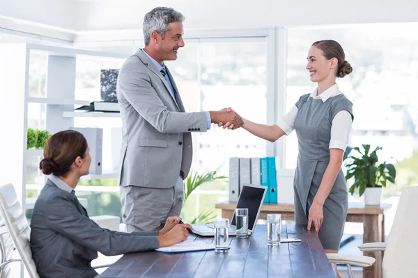Business people shake hands during interview — Stock Photo, Image