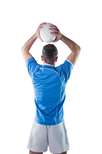 Rugby spiller ved at kaste rugby bold - Stock-foto