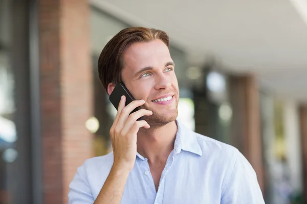 A happy smiling man calling Stock Photo