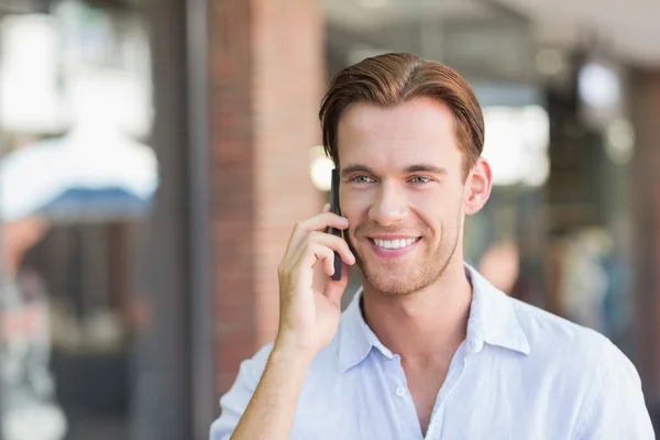 A happy smiling man calling Stock Image