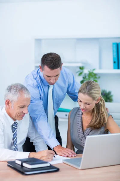 Business partners working on laptop Stock Picture