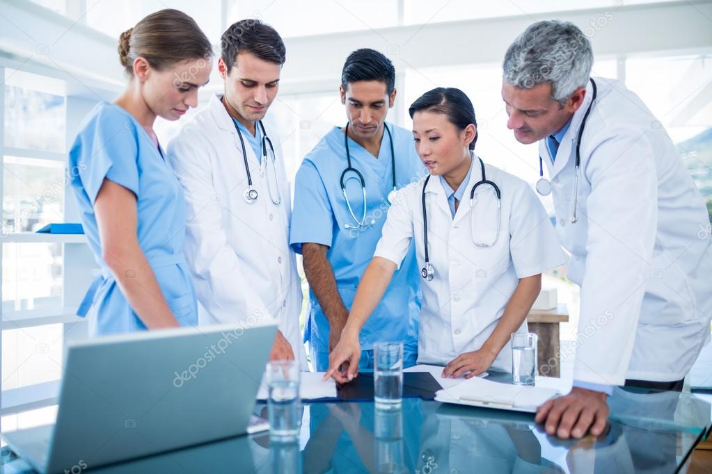 Doctors and nurses discussing together — Stock Photo © Wavebreakmedia