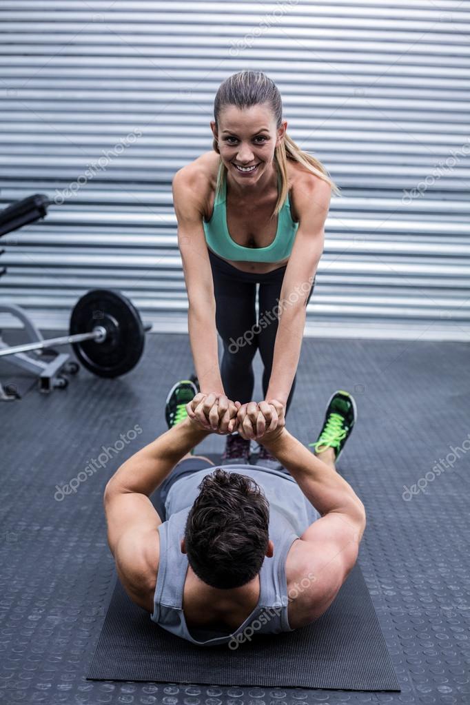 Muscular couple doing core exercises — Stock Photo