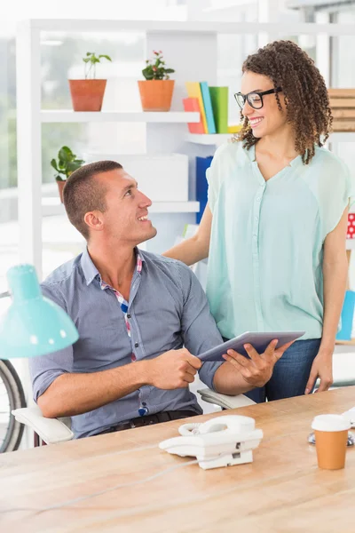 Creative business colleagues using a digital tablet — Stock Photo, Image