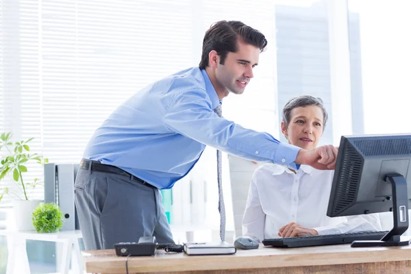 Serious colleagues working together on computer — Stock Photo, Image