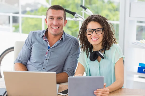 Smiling business colleagues looking at the camera — Stock Photo, Image