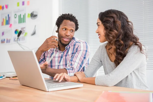 Young business people on laptop — Stock Photo, Image