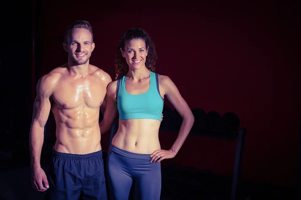 Muscular couple looking at the camera — Stock Photo, Image