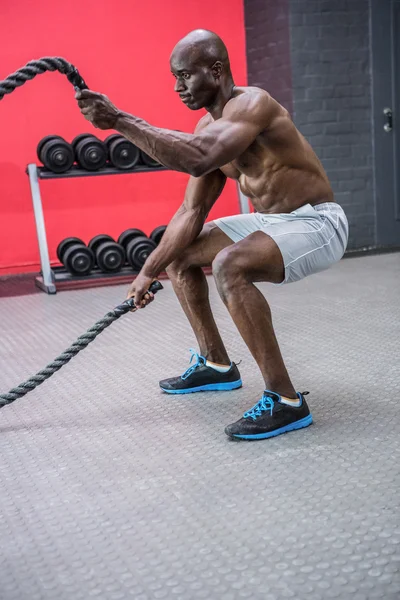 Young Bodybuilder working with ropes — Stock Photo, Image