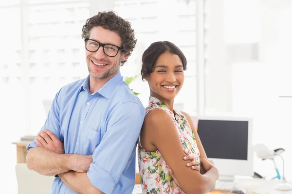 Businesswoman back-to-back with colleague — Stock Photo, Image