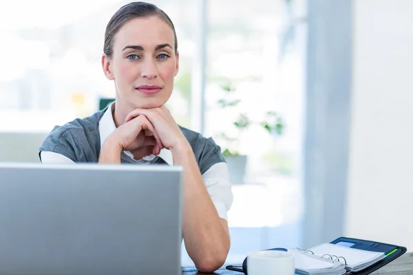 Thoughtful businesswoman looking at camera — Stock Photo, Image