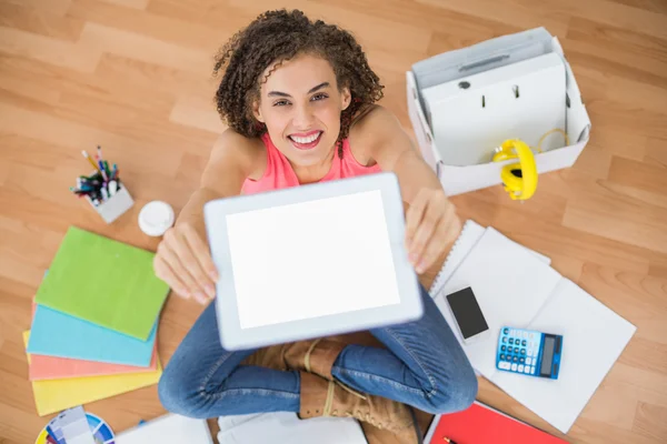 Young creative businesswoman showing her tablet — Stock Photo, Image