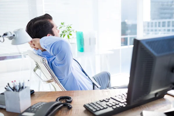 Thoughtful businessman at office desk — Stock Photo, Image