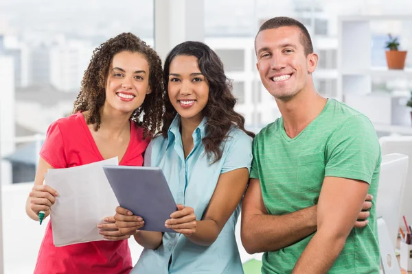 Casual colleagues using digital tablet in office — Stock Photo, Image