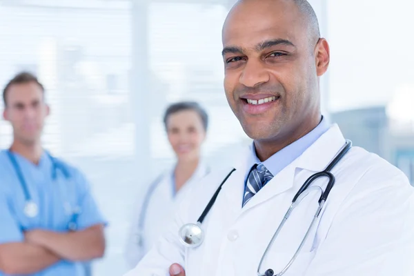 Smiling colleagues doctors looking at the camera — Stock Photo, Image