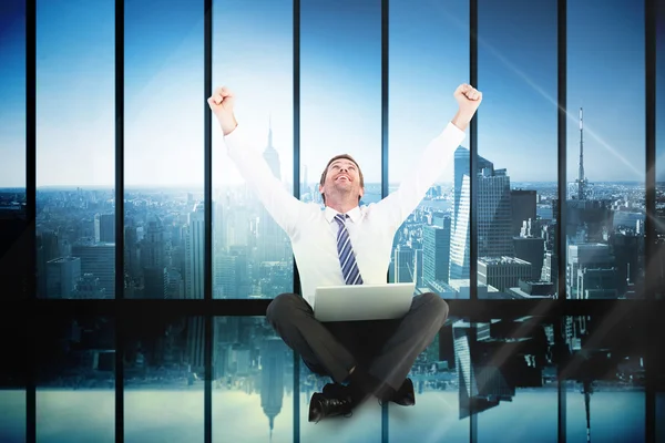 Excited businessman using laptop — Stock Photo, Image
