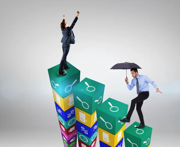 Focused businessman holding umbrella and balancing — Stock Photo, Image