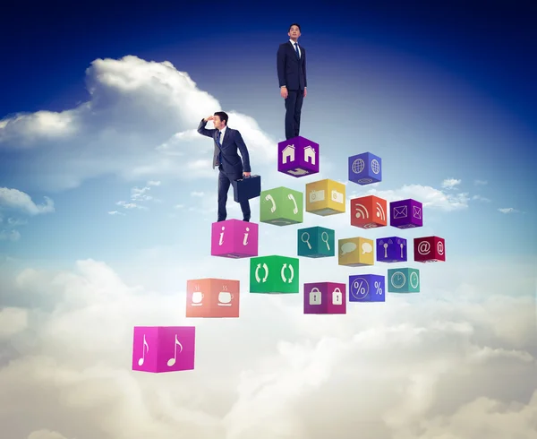 Businessman looking through clouds — Stock Photo, Image