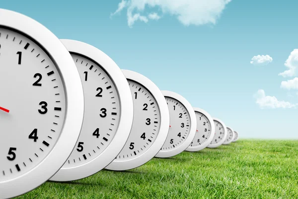 Clocks against blue sky — Stock Photo, Image