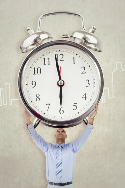 Businessman holding alarm clock — Stock Photo, Image