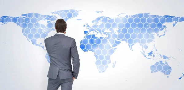 Businessman against world map — Stock Photo, Image