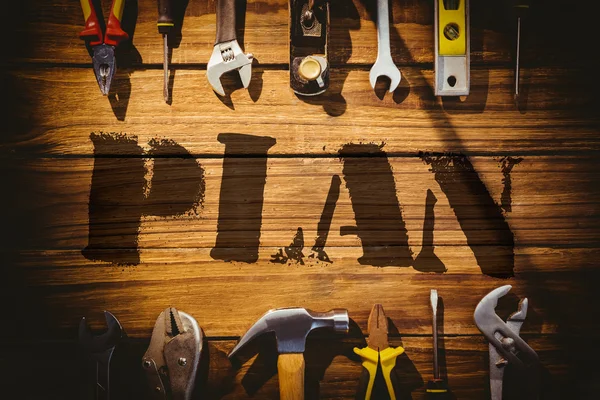 Plan against desk with tools — Stock Photo, Image