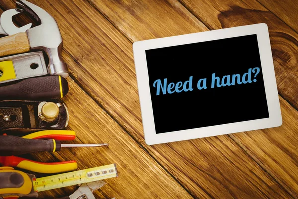 Word een hand nodig? en tablet pc — Stockfoto