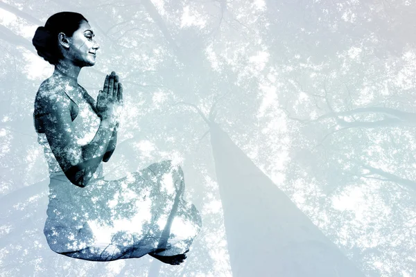 Woman sitting in lotus pose — Stock Photo, Image