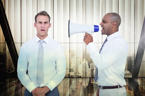 Businessman yelling with megaphone at colleague — Stock Photo, Image