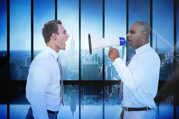Businessman yelling with a megaphone — Stock Photo, Image