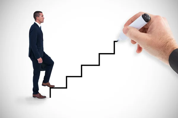 Businessman climbing by painting stairs — Stock Photo, Image