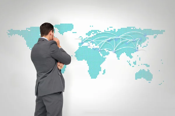 Businessman against world map — Stock Photo, Image