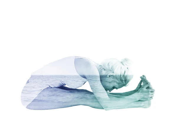 Woman doing the paschimottanasana pose — Stock Photo, Image