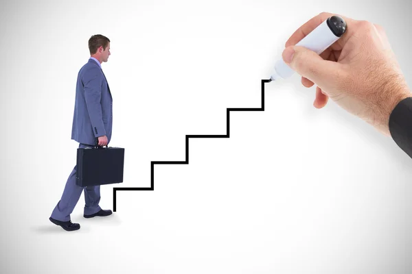 Businessman climbing with briefcase — Stock Photo, Image