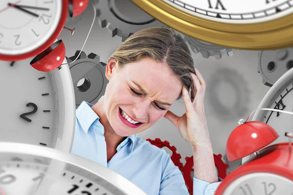 Businesswoman with headache against grey — Stock Photo, Image