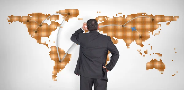 Businessman against world map — Stock Photo, Image