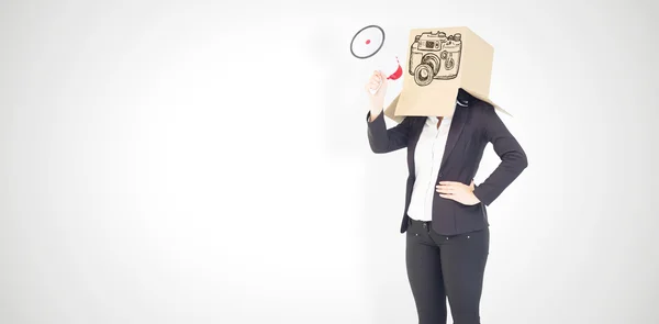 Anonymous businesswoman holding a megaphone — Stock Photo, Image