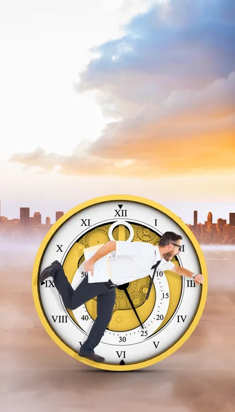 Geeky young businessman running late — Stock Photo, Image