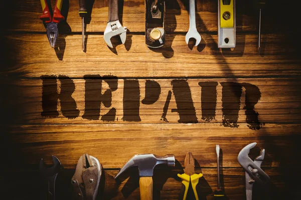 Repair against desk with tools — Stock Photo, Image