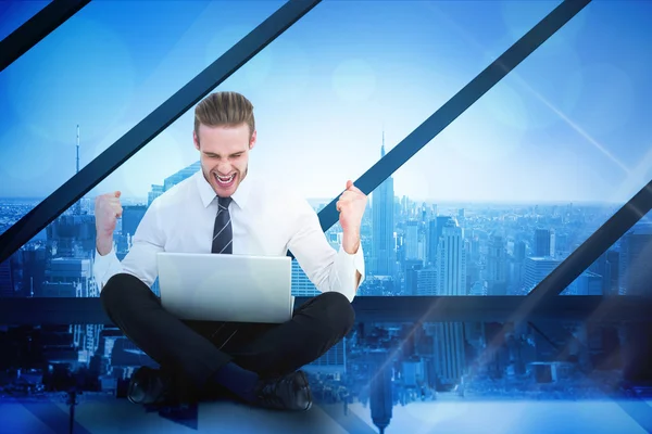 Businessman using laptop and cheering — Stock Photo, Image